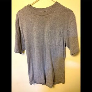 Gray medium size dickies work shirt with front pocket.